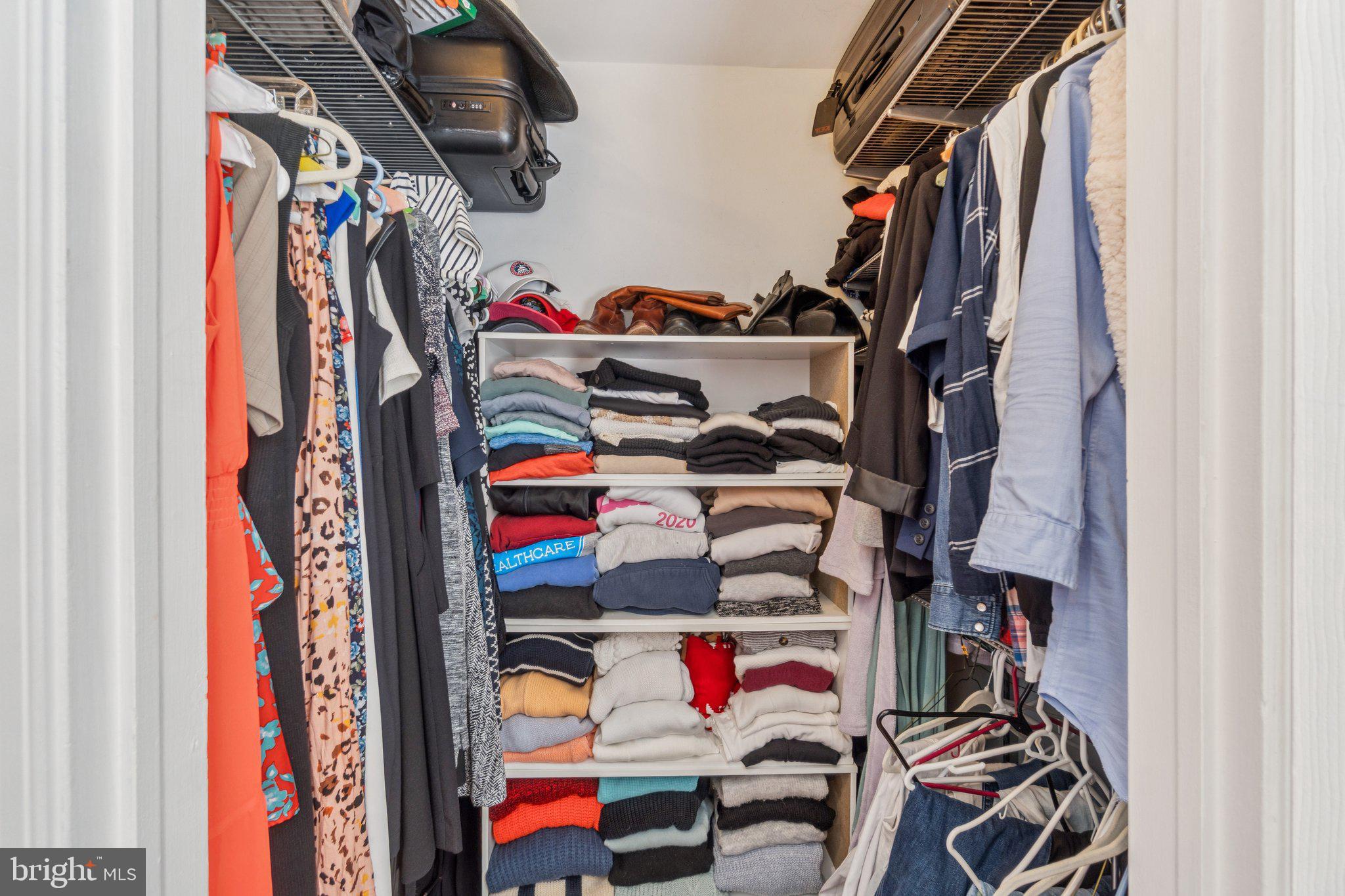 1933 18th Street Northwest, Unit 304 Washington, DC 20009 - Photo 13 of 24 a view of walk in closet with clothes and shoes