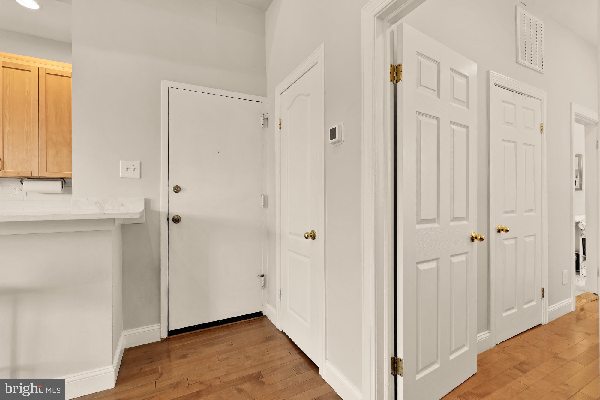 1933 18th Street Northwest, Unit 304 Washington, DC 20009 - Photo 16 of 24 a view of a hallway with wooden floor