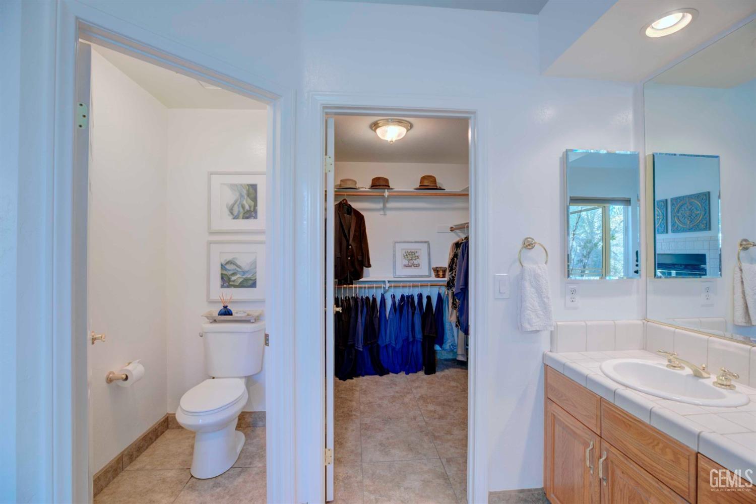Undisclosed Address Bakersfield, CA 93312 - Photo 13 of 33 a bathroom with a sink a toilet and shower