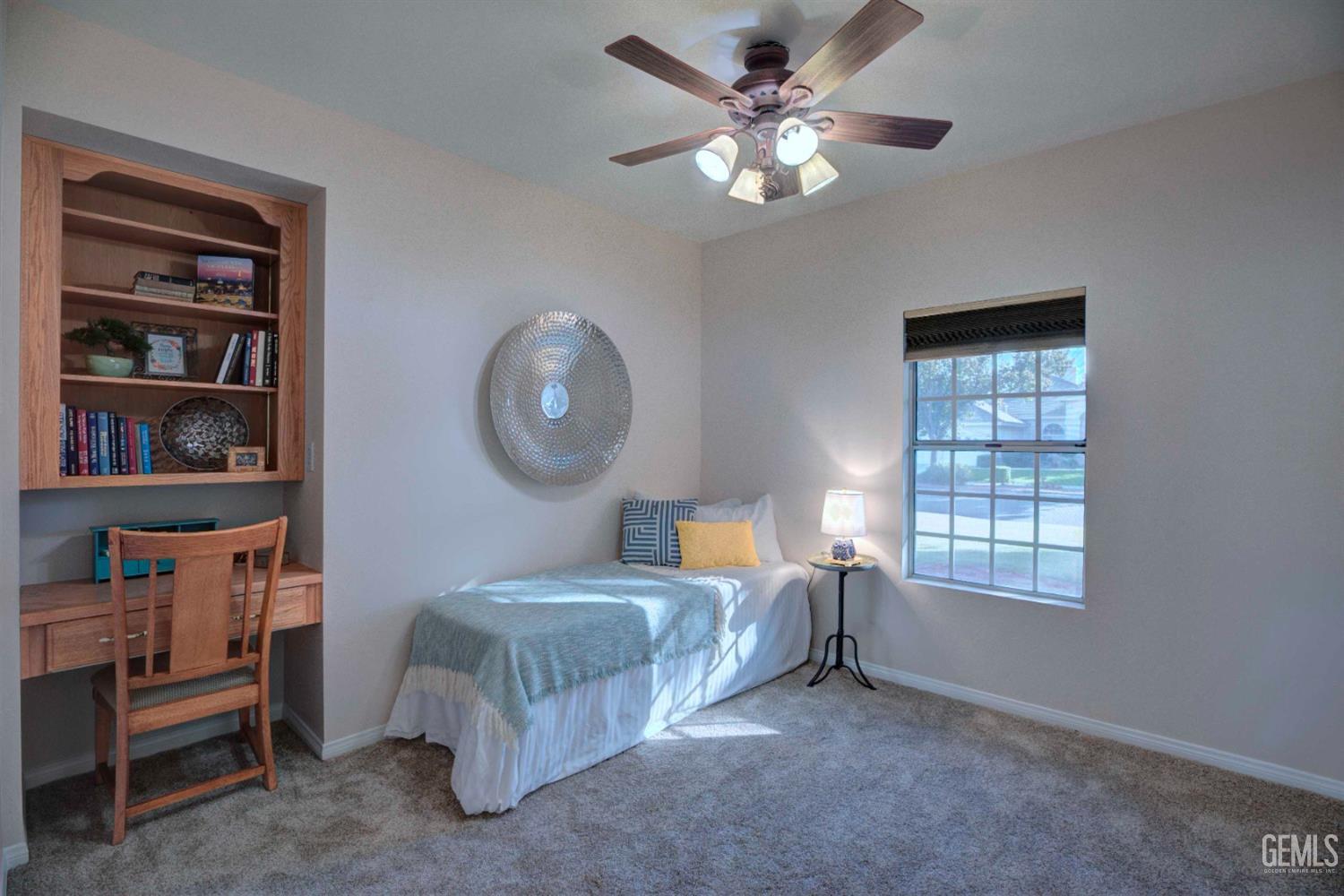 Undisclosed Address Bakersfield, CA 93312 - Photo 14 of 33 a bed room with a bed and a window