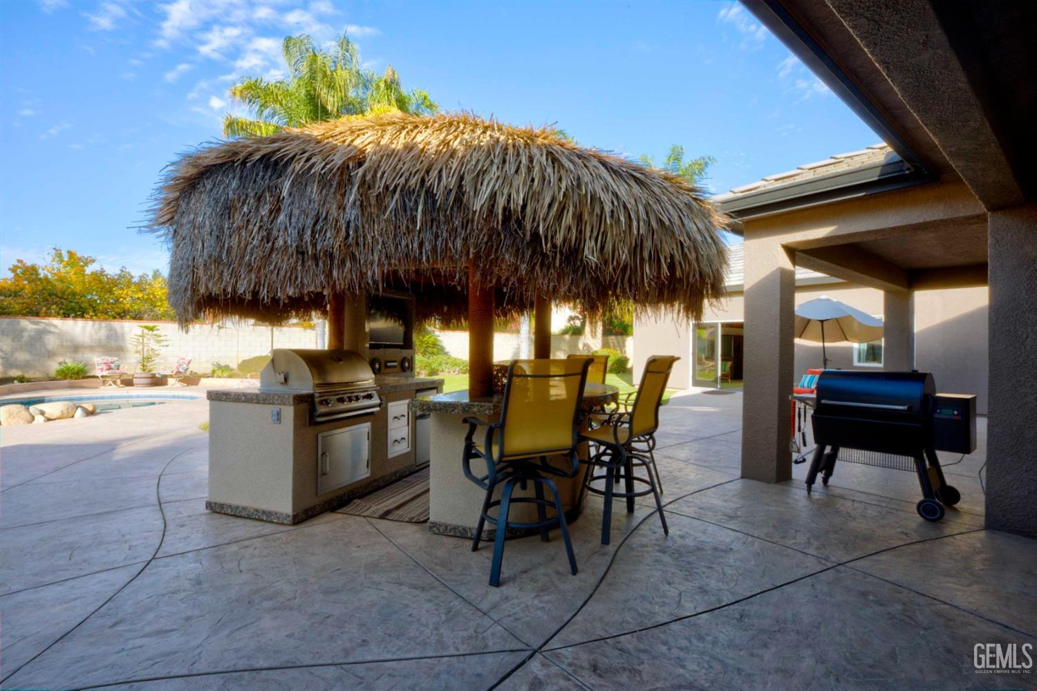 Undisclosed Address Bakersfield, CA 93312 - Photo 19 of 33 a view of backyard with outdoor seating and patio