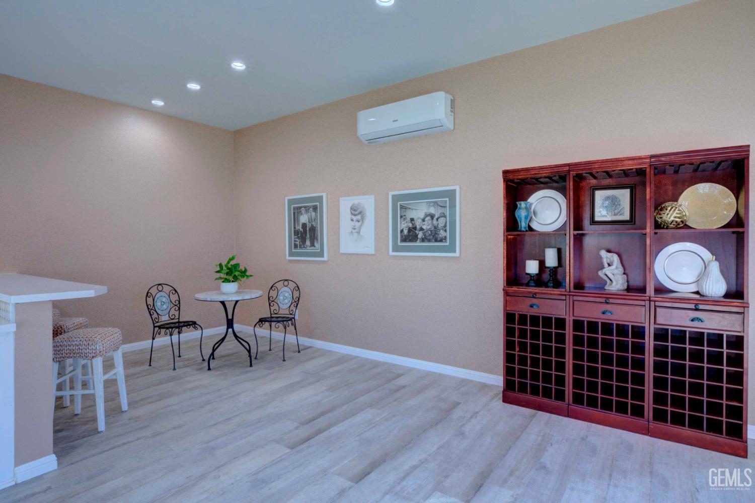 Undisclosed Address Bakersfield, CA 93312 - Photo 26 of 33 a view of a dining room with furniture and wooden floor