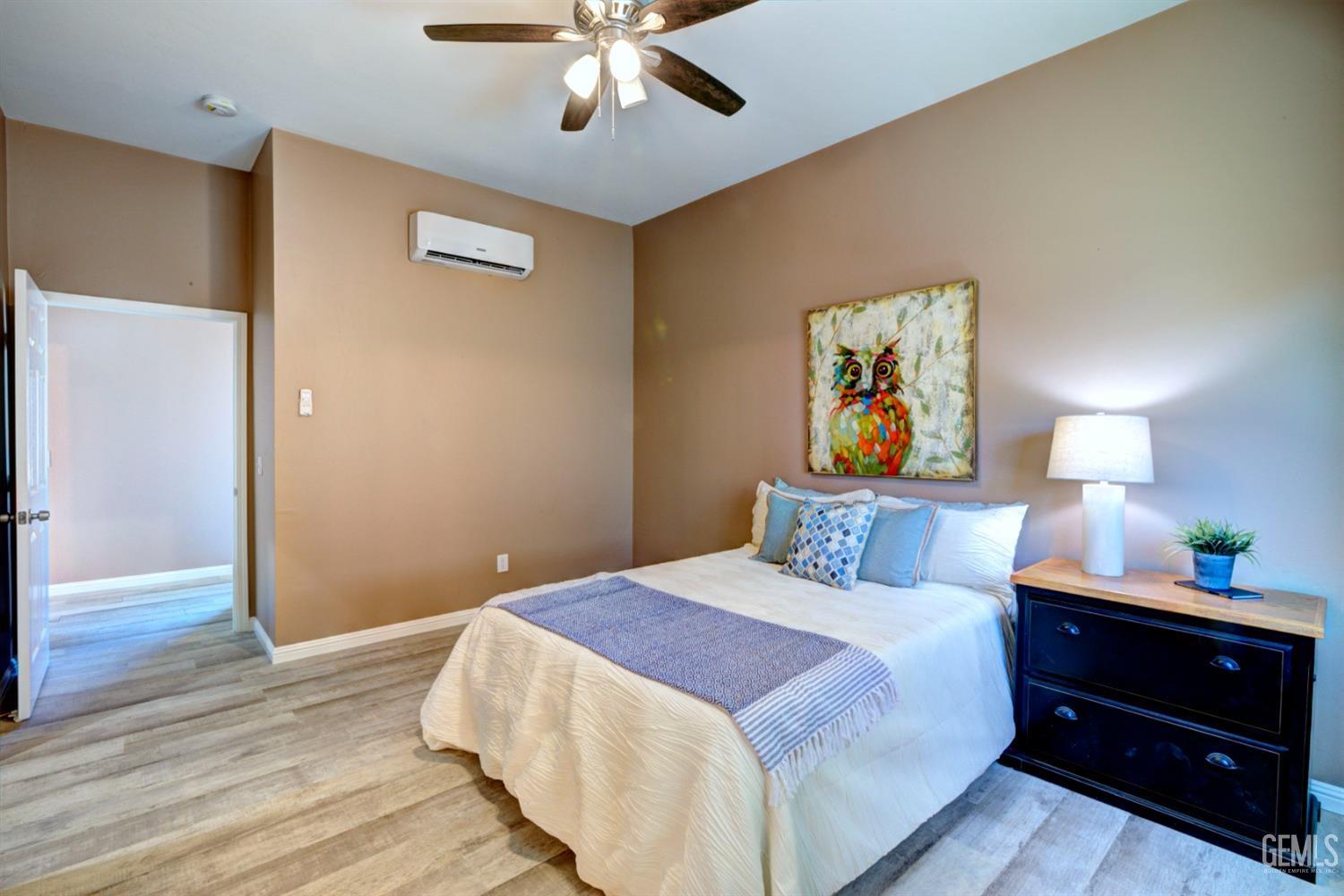 Undisclosed Address Bakersfield, CA 93312 - Photo 27 of 33 a bedroom with a bed and a chandelier