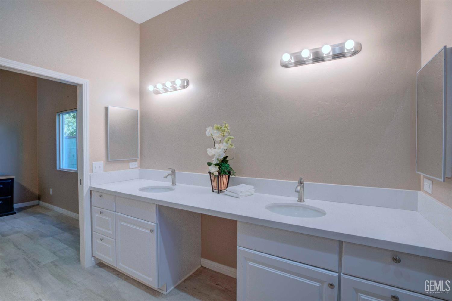 Undisclosed Address Bakersfield, CA 93312 - Photo 28 of 33 a bathroom with a sink and a mirror