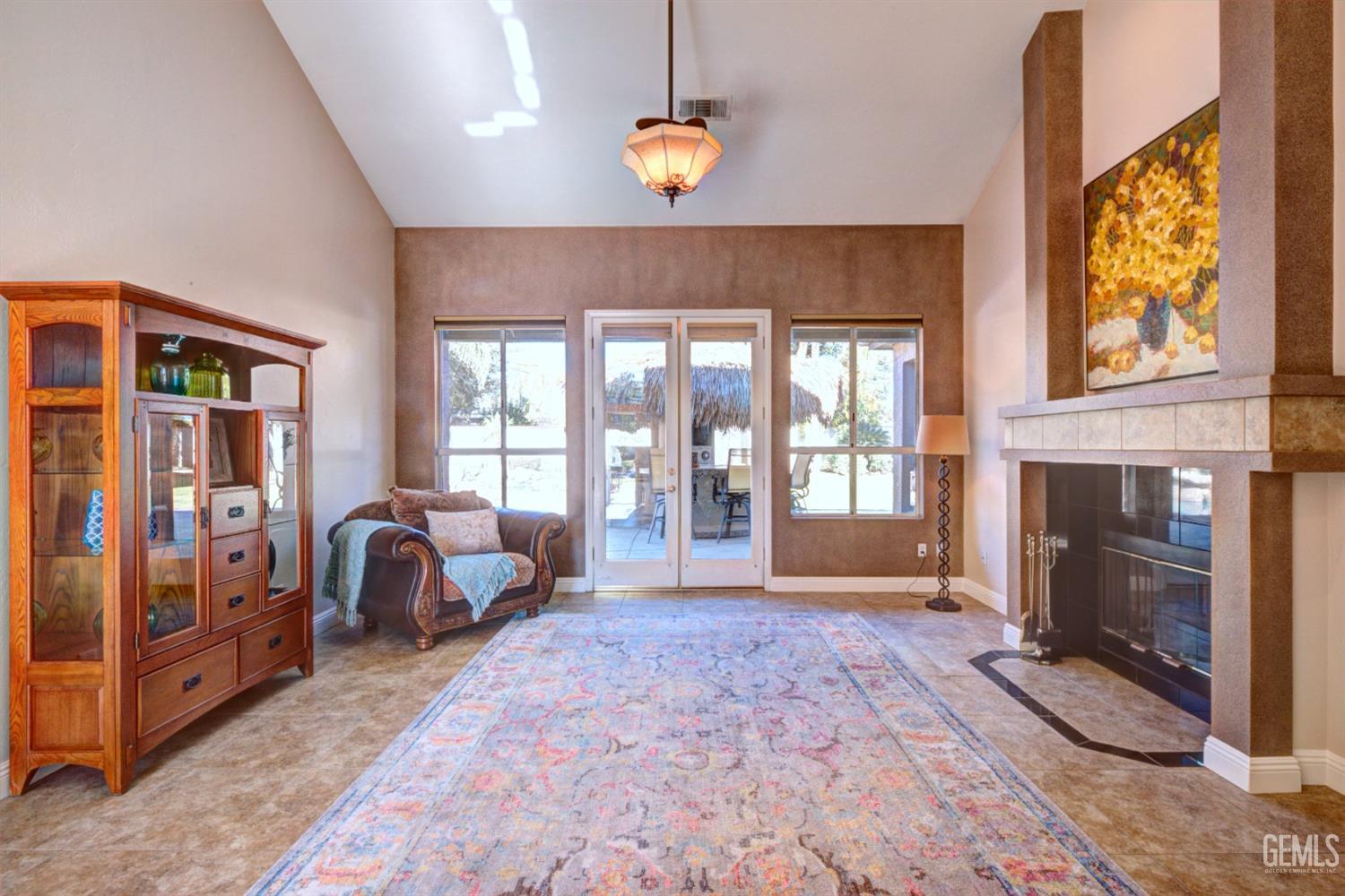 Undisclosed Address Bakersfield, CA 93312 - Photo 4 of 33 a bedroom with furniture and a fireplace