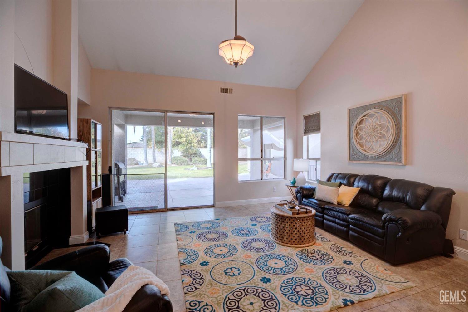 Undisclosed Address Bakersfield, CA 93312 - Photo 6 of 33 a living room with furniture fireplace and flat screen tv