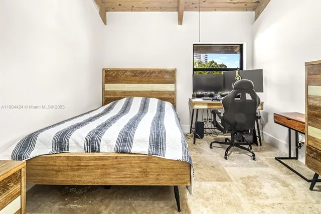 a bedroom with a bed and a bookshelf