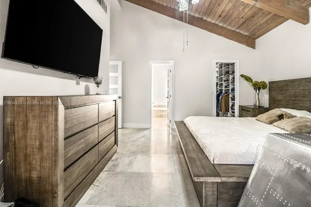 a kitchen with a sink appliances and cabinets