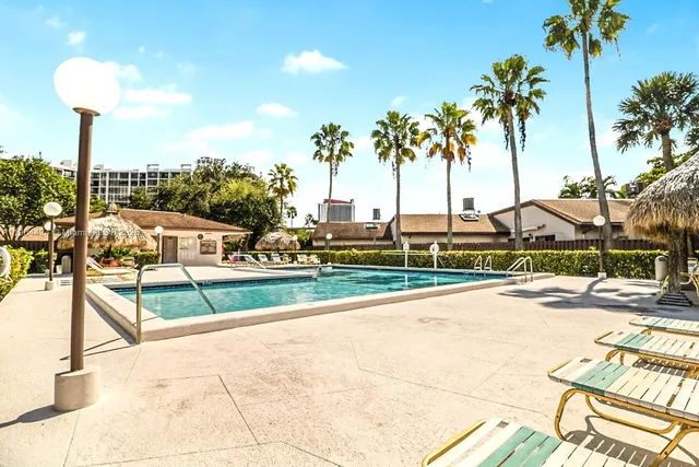 a view of a park with palm trees