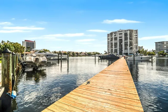 a park with view of water and city