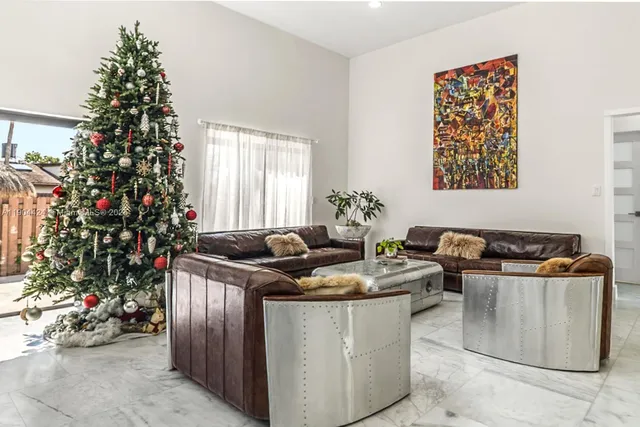 a table with a potted plant and a window