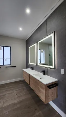 a bathroom with a glass shower door