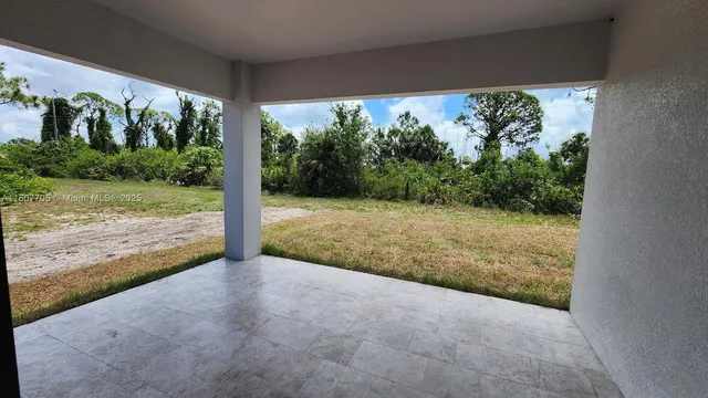 a view of a room with porch and mountain view