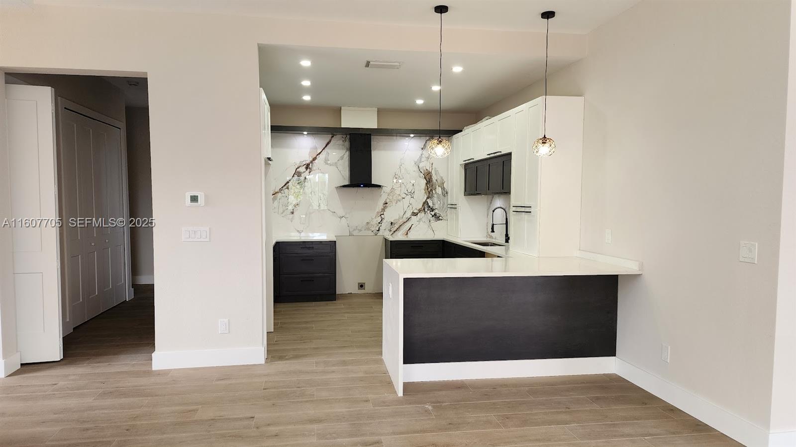 47 East Brig Circle Placida, FL 33946 - Photo 6 of 39 a view of living room with furniture and wooden floor