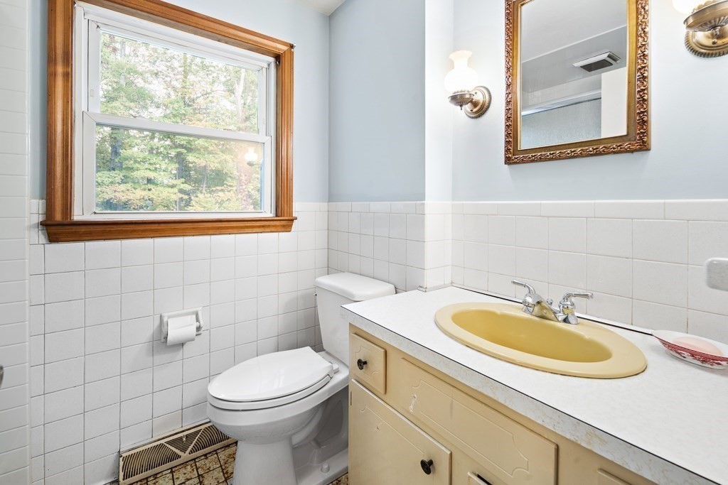 53 Cochato Park Randolph, MA 02368 - Photo 14 of 20 a bathroom with a sink a toilet and a mirror
