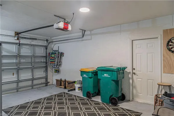 a view of a room with shelves closet and windows