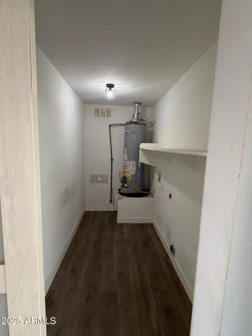 a view of a storage & utility room with wooden floor