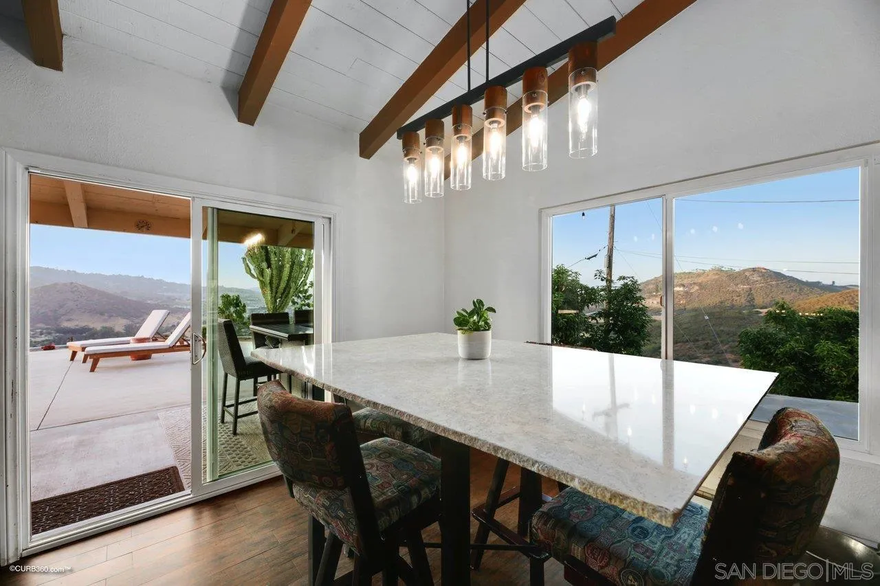 2925 Cordrey Drive Escondido, CA 92029 - Photo 11 of 75 a dining room with furniture and a floor to ceiling window