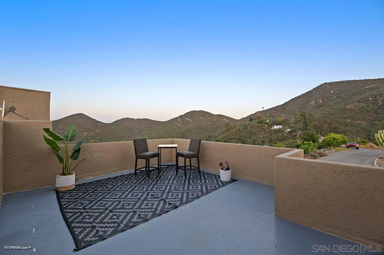 2925 Cordrey Drive Escondido, CA 92029 - Photo 18 of 75 a view of a terrace with a table and a potted plant