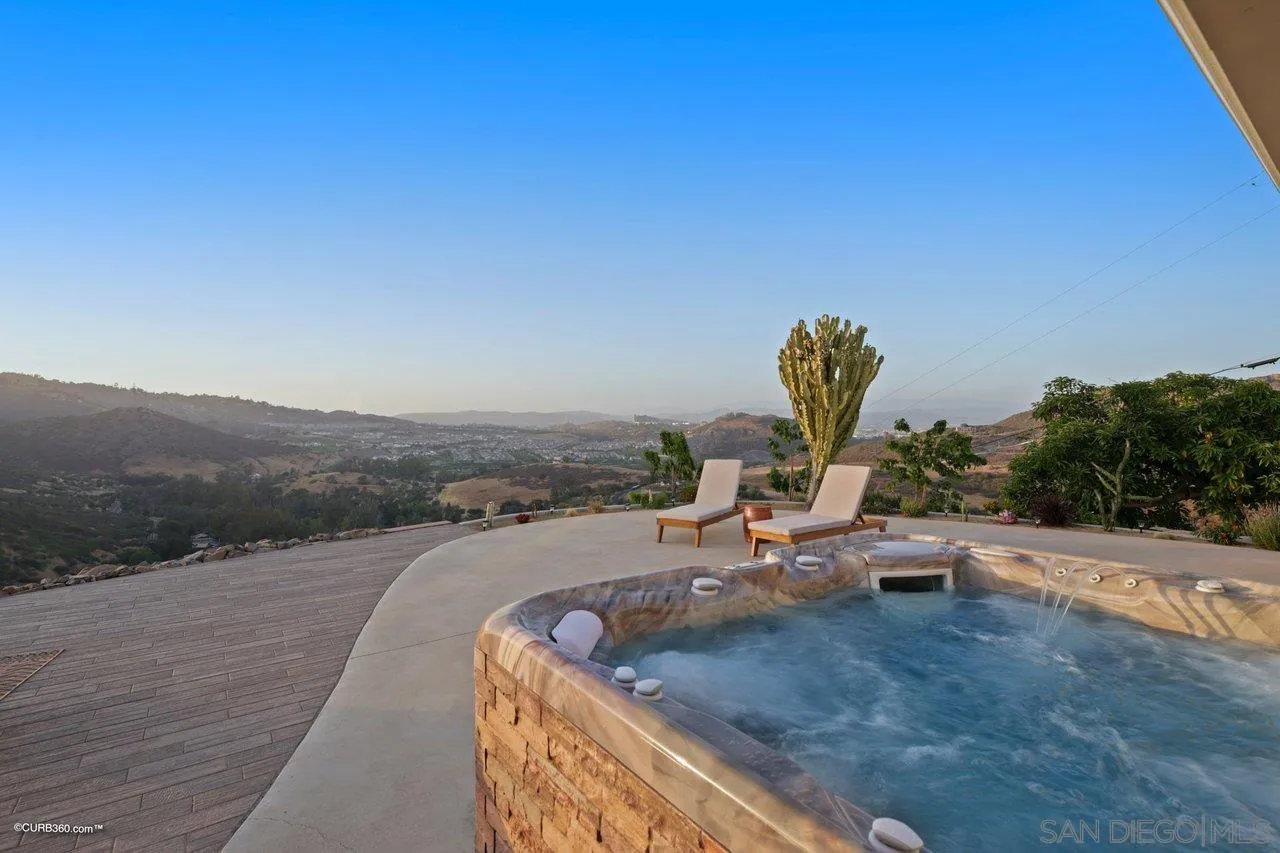 2925 Cordrey Drive Escondido, CA 92029 - Photo 19 of 75 a view of a swimming pool with a lounge chair