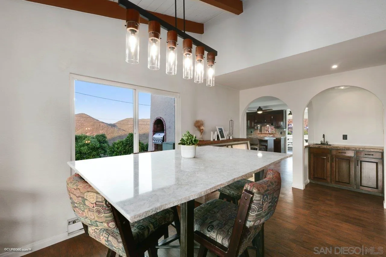 2925 Cordrey Drive Escondido, CA 92029 - Photo 24 of 75 a large kitchen with a table and chairs