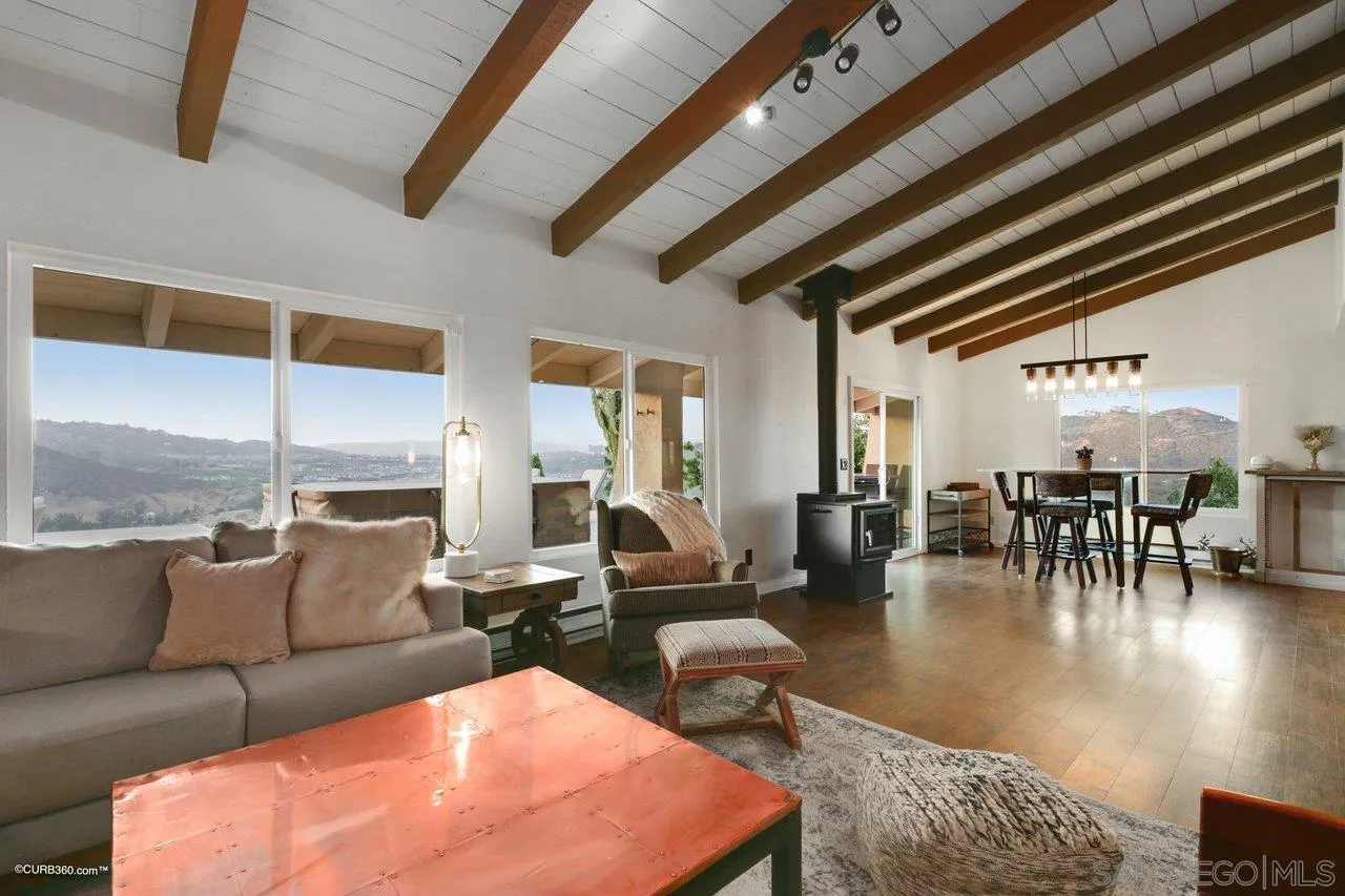 2925 Cordrey Drive Escondido, CA 92029 - Photo 26 of 75 a living room with furniture and floor to ceiling window