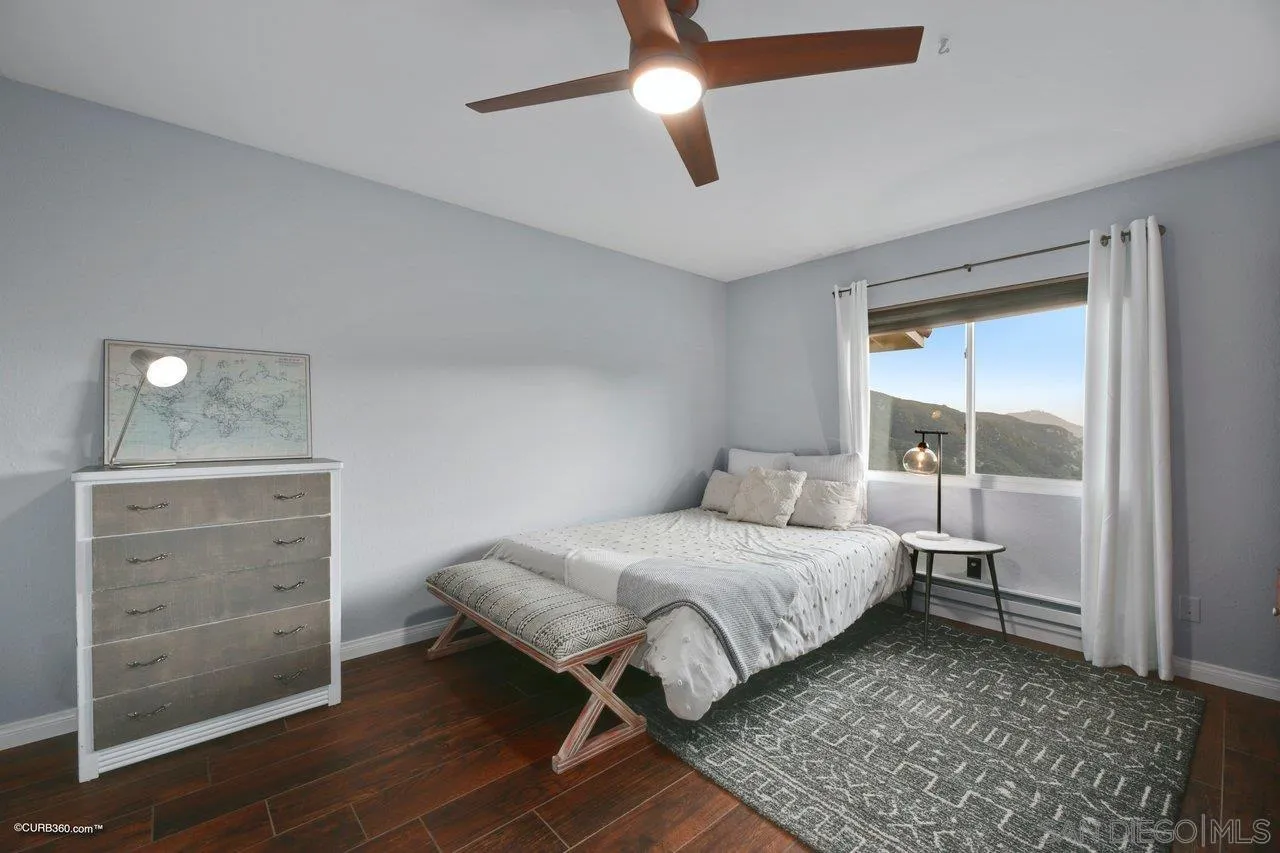 2925 Cordrey Drive Escondido, CA 92029 - Photo 30 of 75 a bedroom with a bed and a mirror