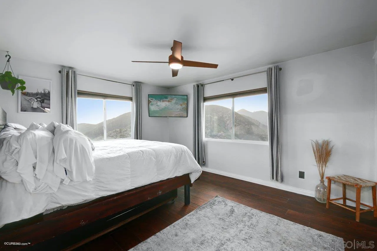 2925 Cordrey Drive Escondido, CA 92029 - Photo 32 of 75 a bed sitting in a bedroom next to a window