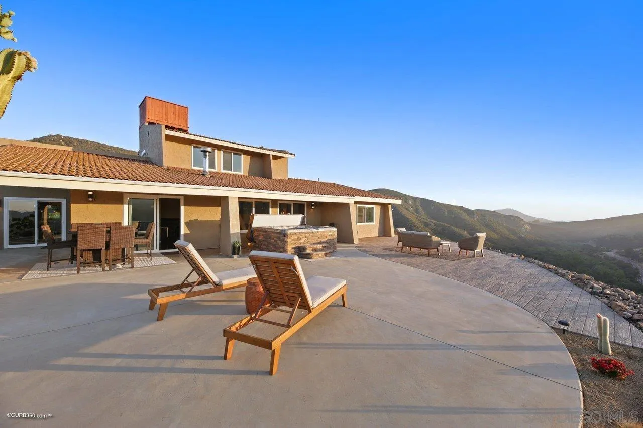 2925 Cordrey Drive Escondido, CA 92029 - Photo 37 of 75 a front view of a house with glass top table and chairs
