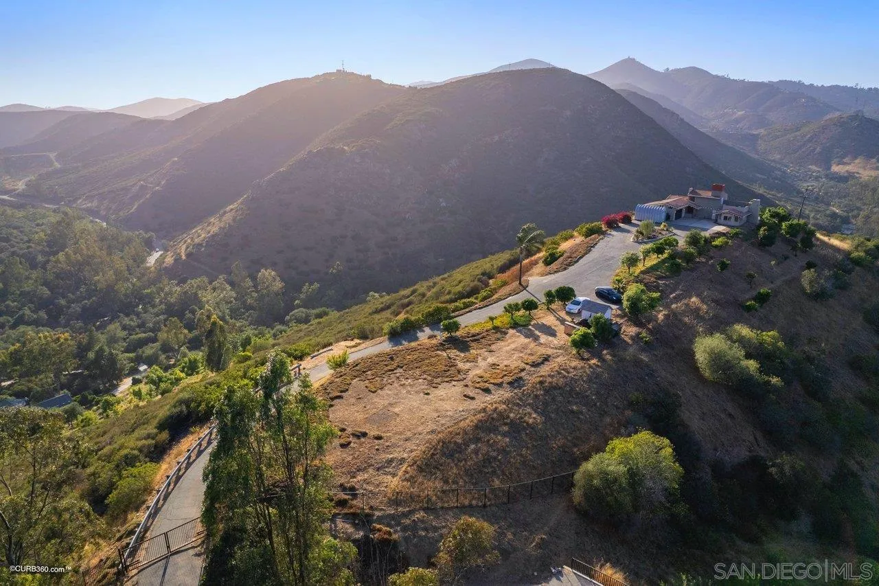 2925 Cordrey Drive Escondido, CA 92029 - Photo 51 of 75 a view of a house with a mountain and a forest