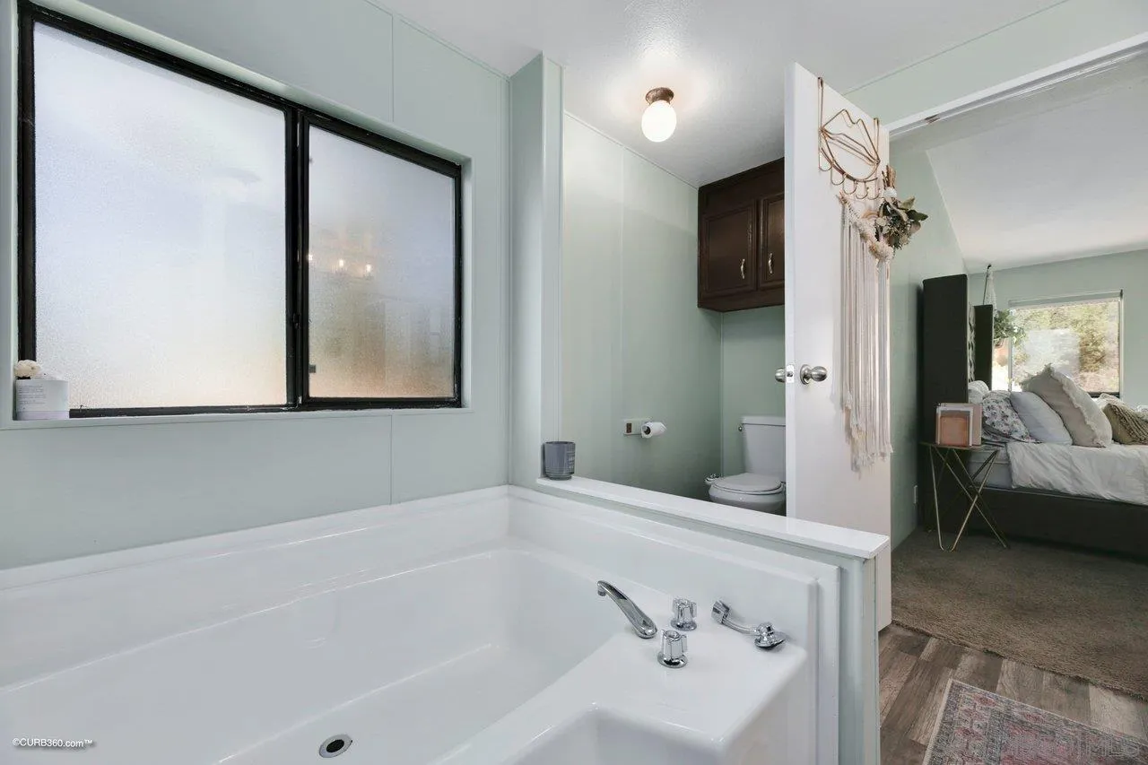 2925 Cordrey Drive Escondido, CA 92029 - Photo 67 of 75 a bathroom with a bathtub and a shower