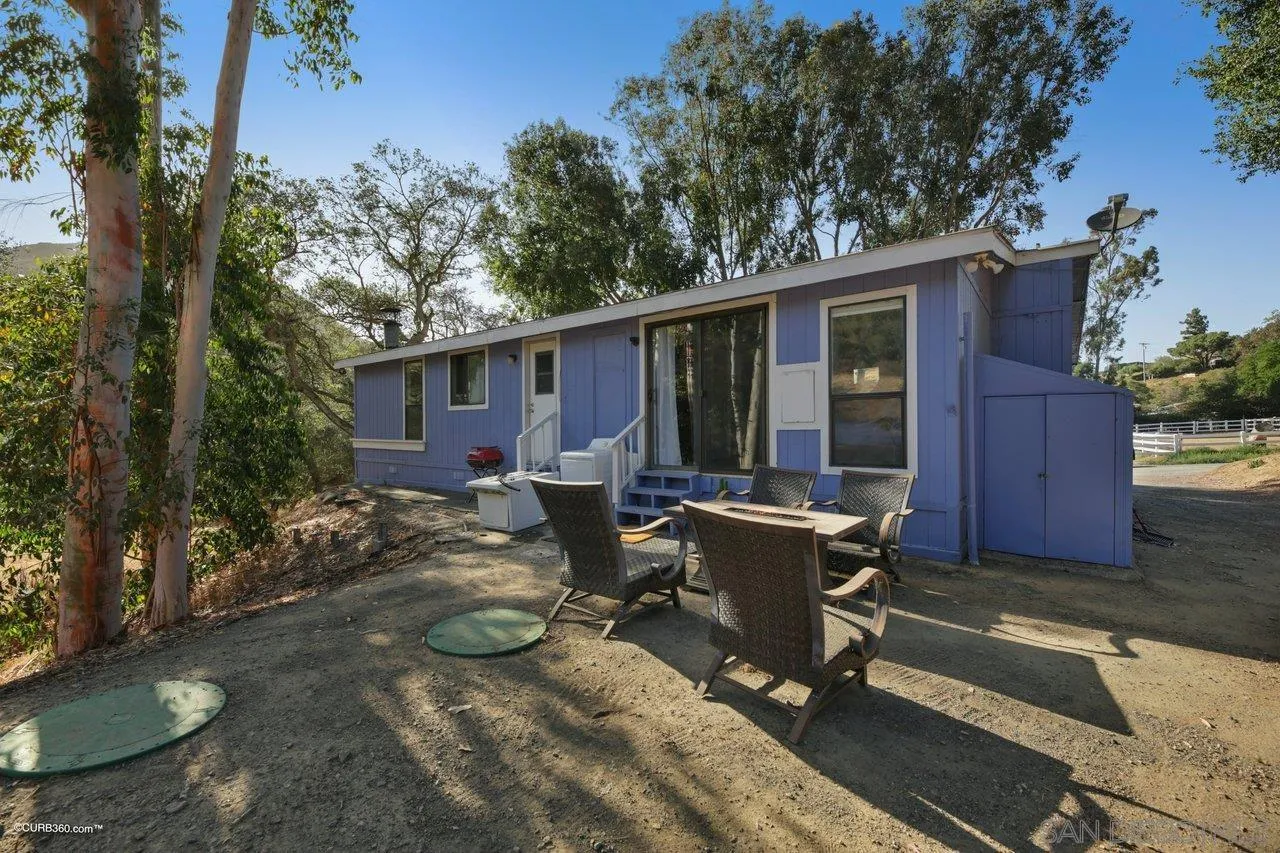2925 Cordrey Drive Escondido, CA 92029 - Photo 73 of 75 a view of a house with backyard sitting area and garden