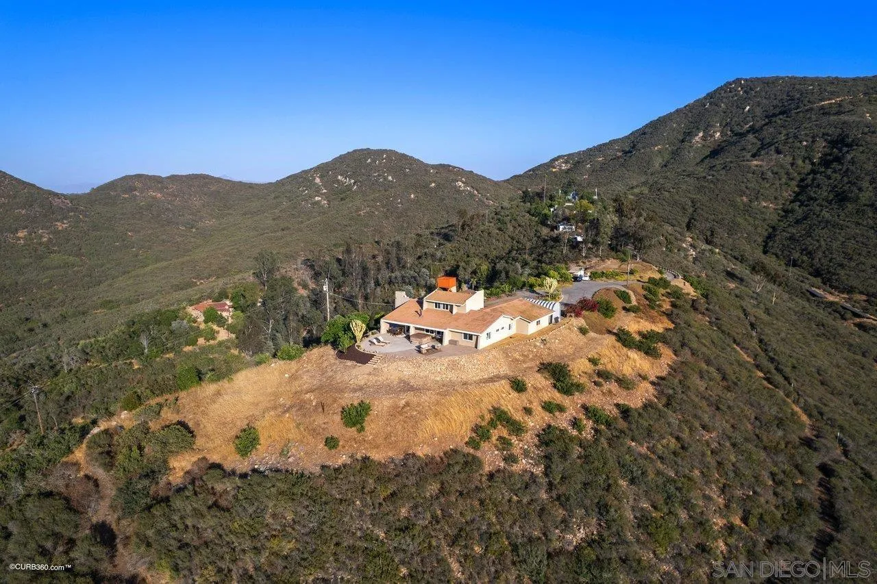 2925 Cordrey Drive Escondido, CA 92029 - Photo 75 of 75 a view of a dry yard with mountains in the background