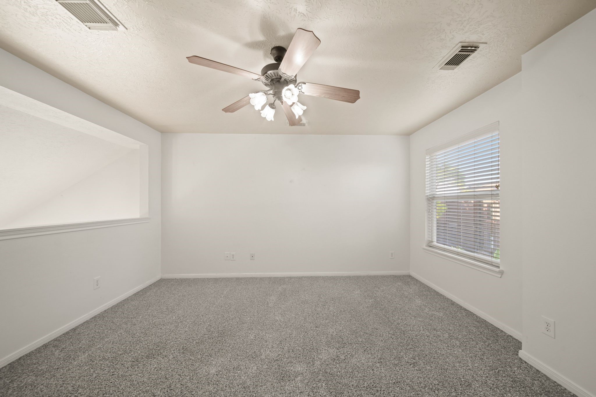 813 Davis Road League City, TX 77573 - Photo 14 of 22 an empty room with windows and fan