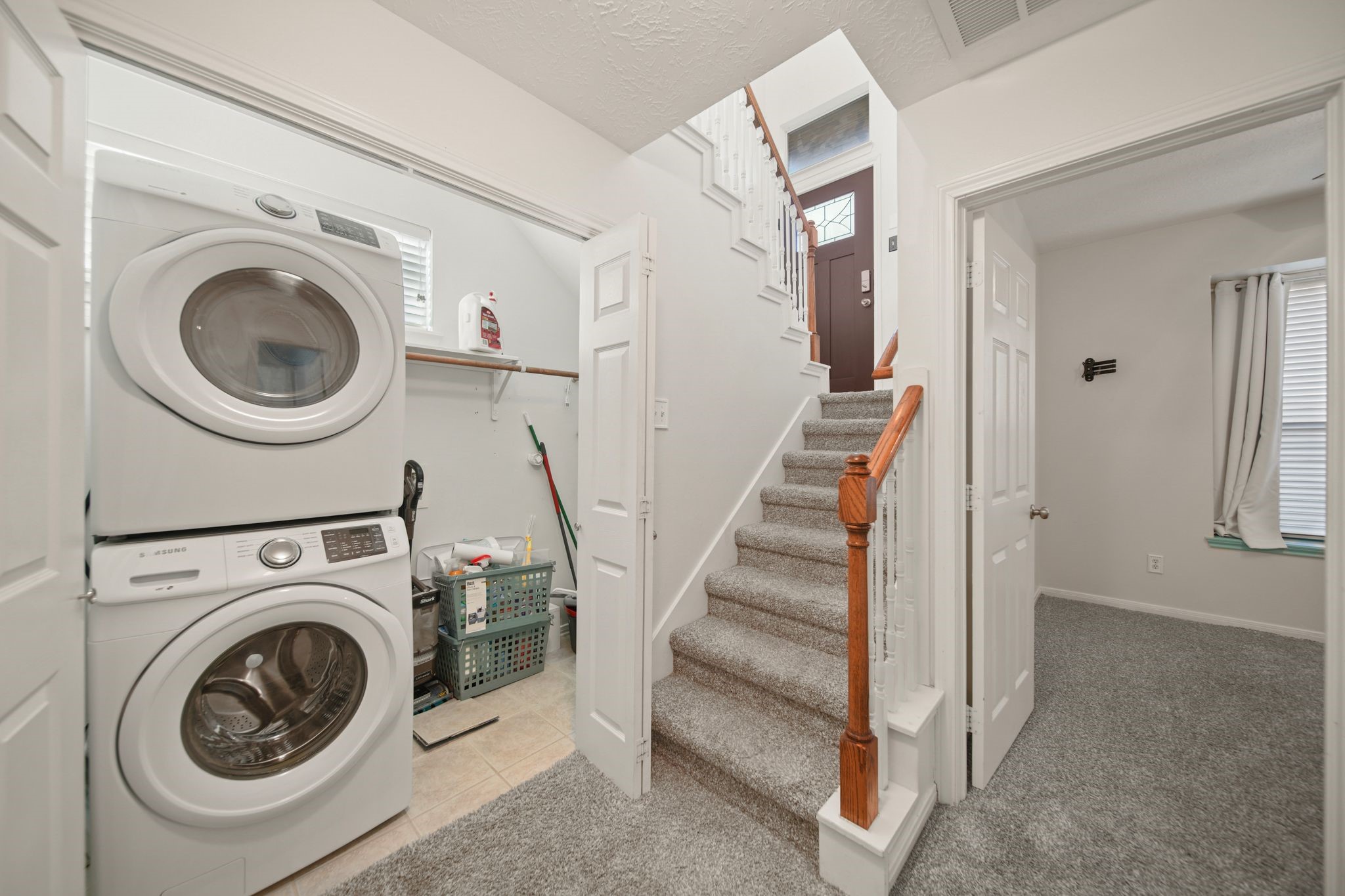 813 Davis Road League City, TX 77573 - Photo 19 of 22 a view of a hallway with washer and dryer