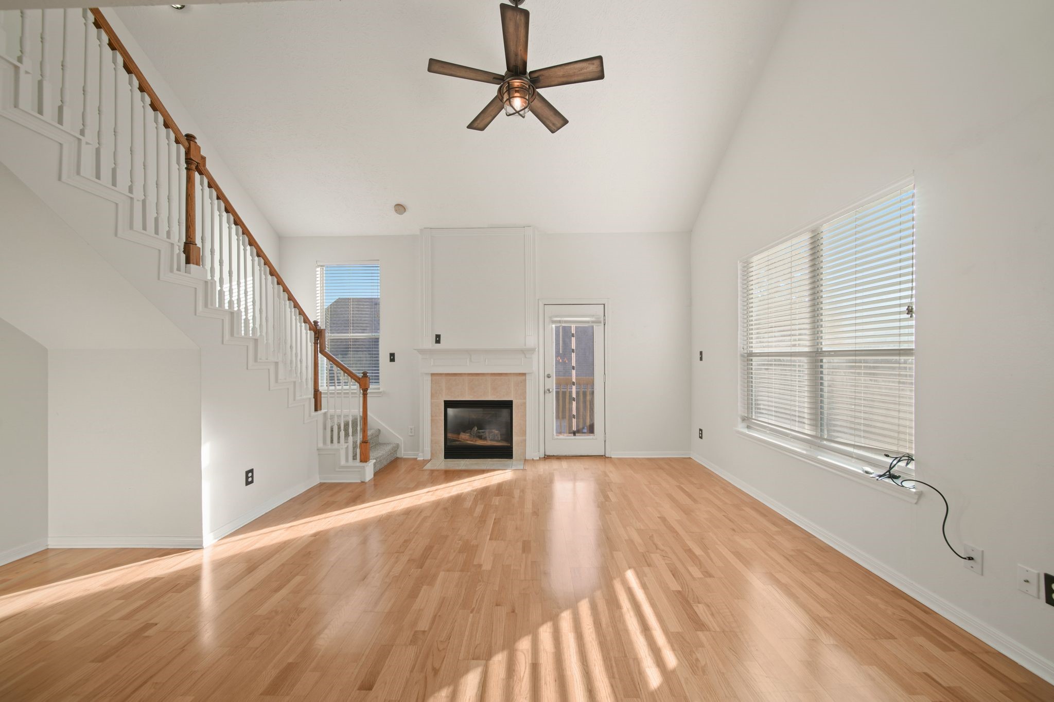 813 Davis Road League City, TX 77573 - Photo 7 of 22 a view of empty room with wooden floor and fan
