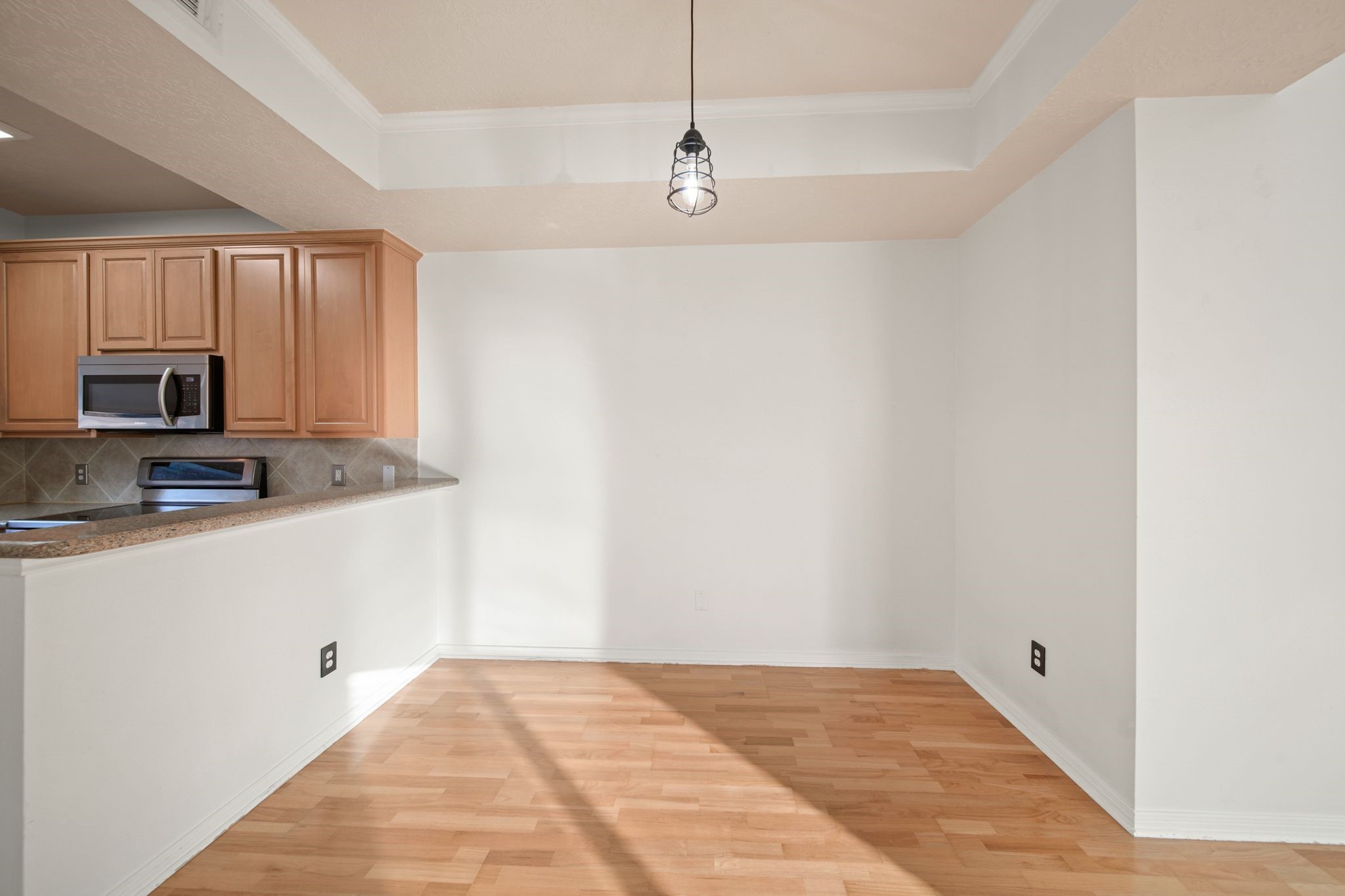 813 Davis Road League City, TX 77573 - Photo 10 of 22 a view of a kitchen with microwave and cabinets
