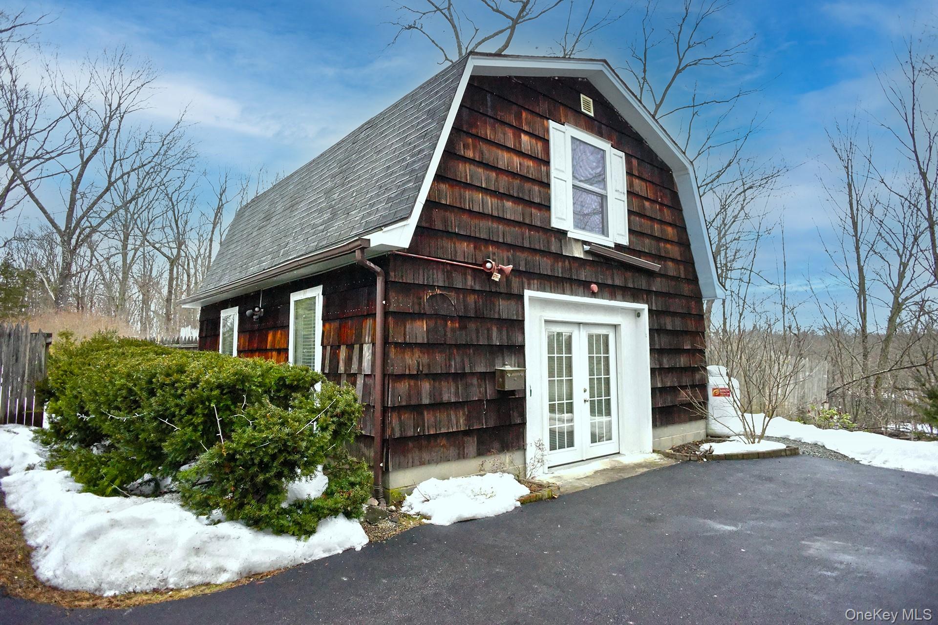 336 Diddell Road Poughkeepsie, NY 12603 - Photo 1 of 1 View of snow covered exterior with a shingled roof, a gambrel roof, and french doors