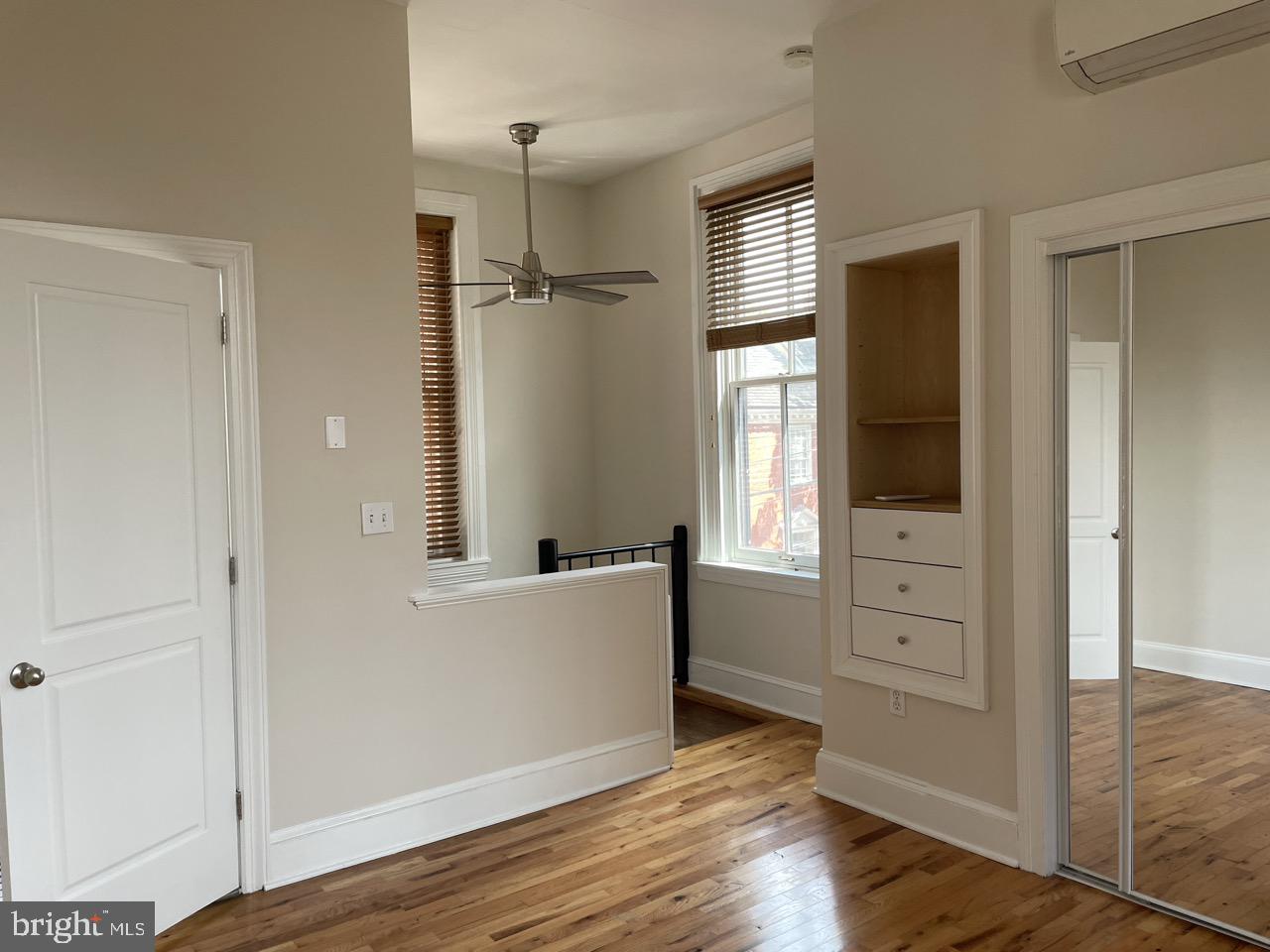 1601 Shakespeare Street, Unit 1R Baltimore, MD 21231 - Photo 9 of 10 wooden floor and windows in a room