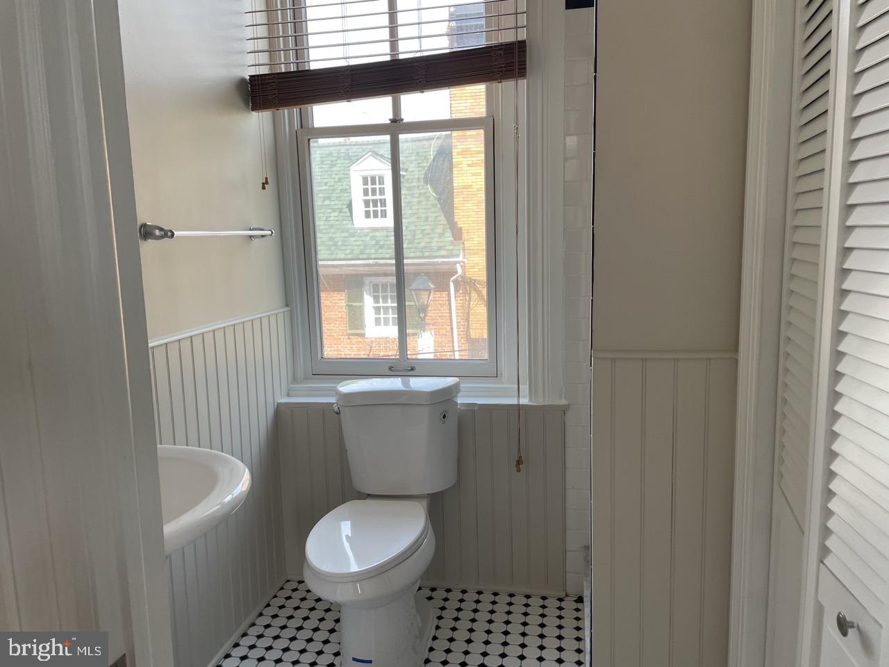1601 Shakespeare Street, Unit 1R Baltimore, MD 21231 - Photo 10 of 10 a bathroom with a toilet a sink and a window