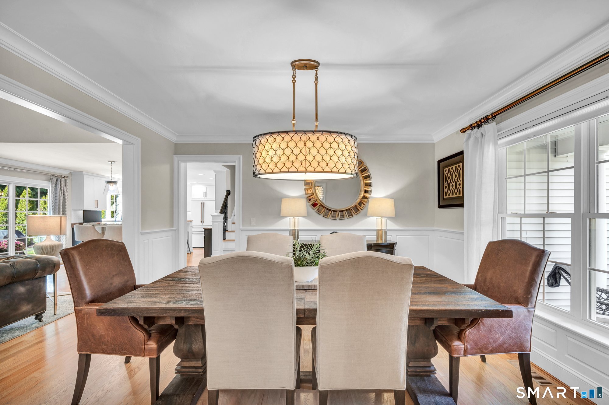 11 Grimes Road Rocky Hill, CT 06067 - Photo 5 of 40 Dining room is open to Living room and kitchen. Features beautiful hardwood floors, custom crown molding, wainscoting detaiils.
