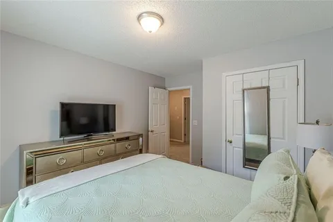 a bathroom with a shower and a sink