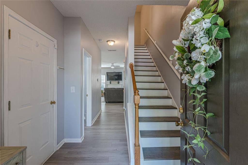 7640 Rutgers Circle Fairburn, GA 30213 - Photo 4 of 46 a view of entryway with wooden floor