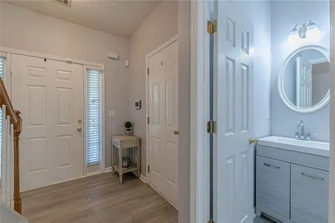 a living room with furniture fireplace and flat screen tv