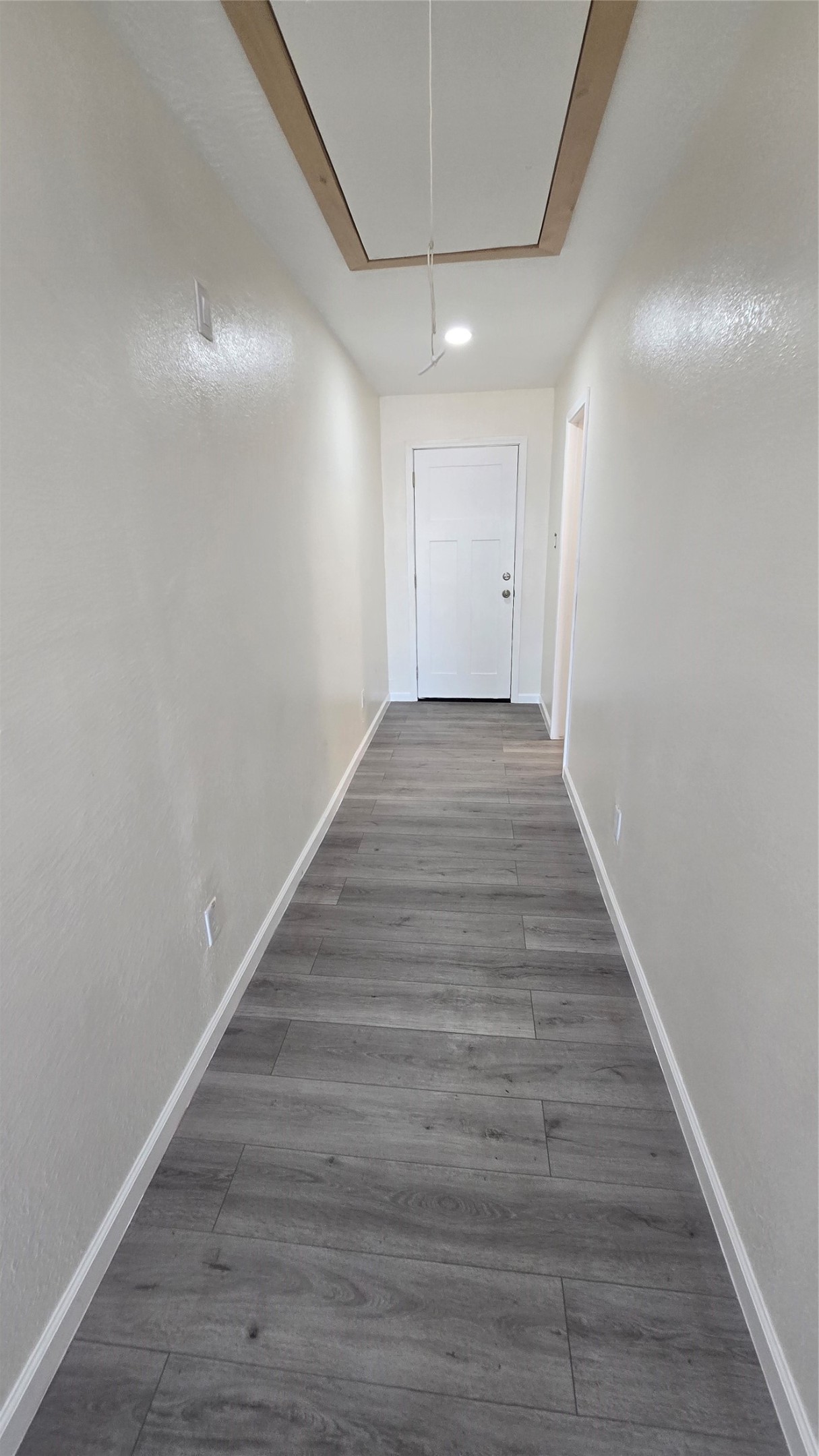 6076 Road 3550 Cleveland, TX 77327 - Photo 14 of 20 a view of an empty room with wooden floor