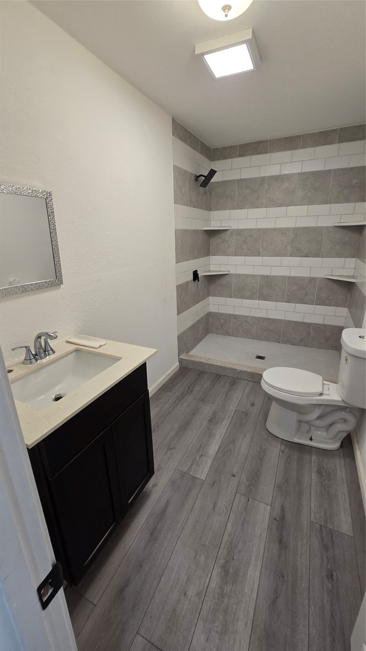 6076 Road 3550 Cleveland, TX 77327 - Photo 15 of 20 a bathroom with a sink and a mirror
