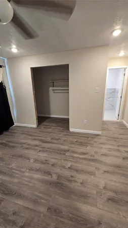 a view of cabinets and wooden floor