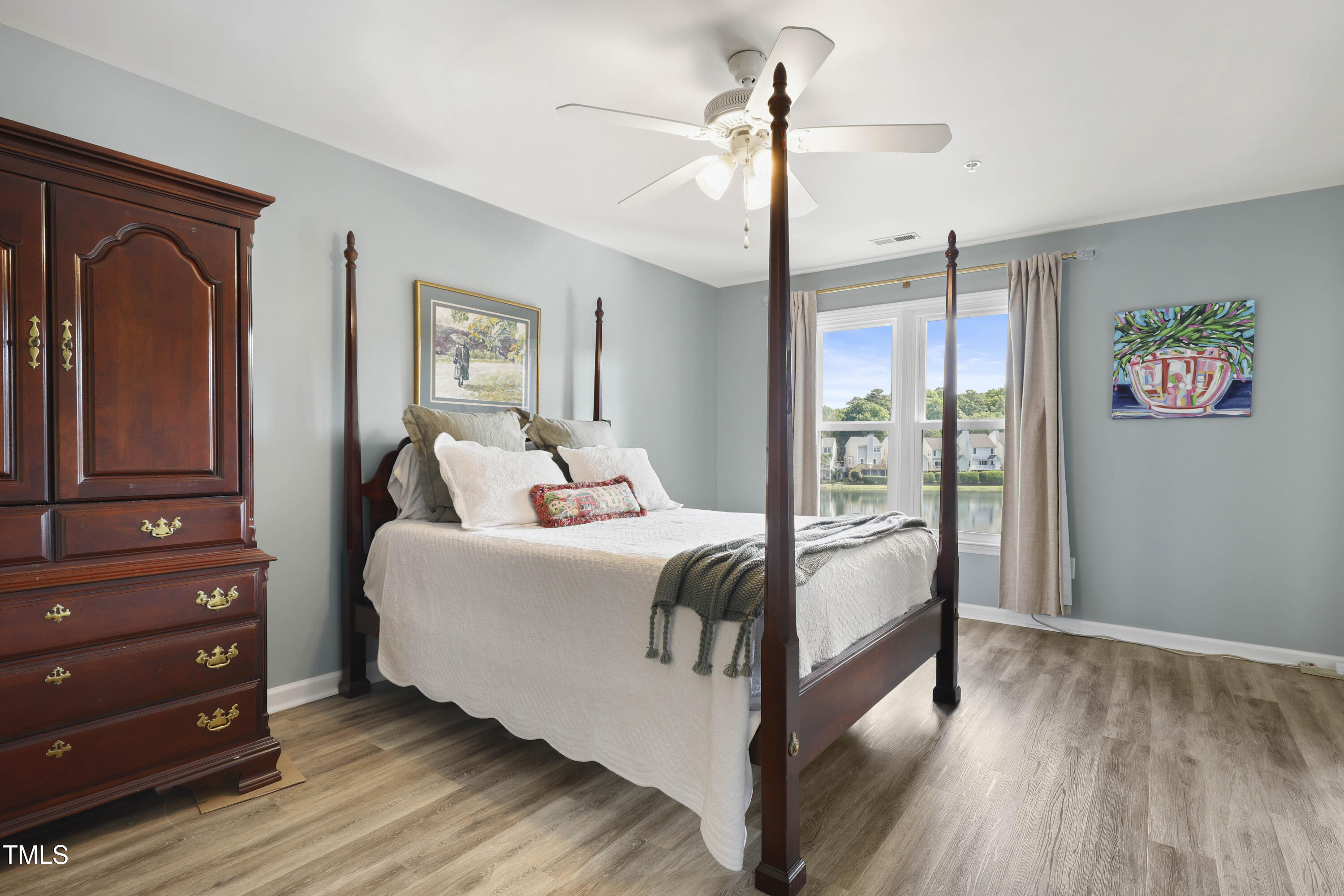 720 Springfork Drive Cary, NC 27513 - Photo 14 of 34 a room with a bed and a dresser