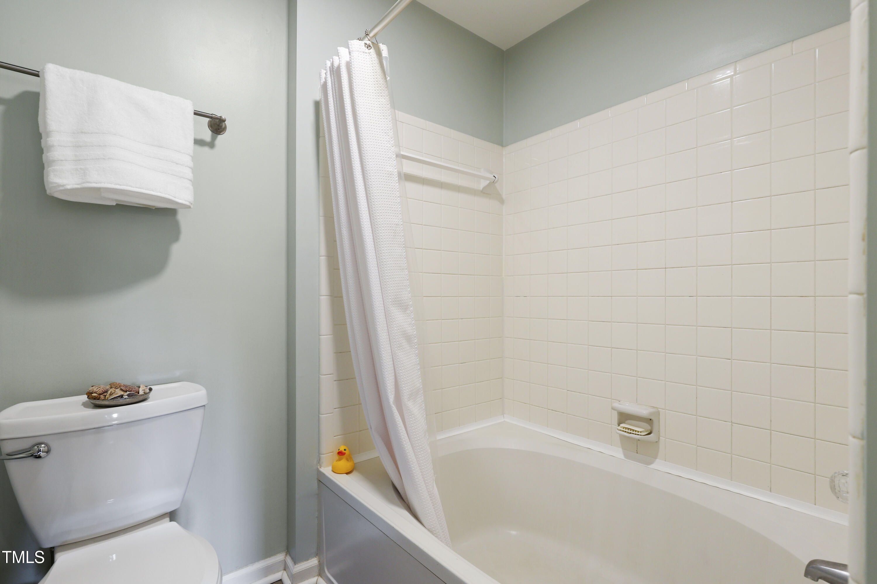 720 Springfork Drive Cary, NC 27513 - Photo 19 of 34 a white bath tub sitting next to a white toilet