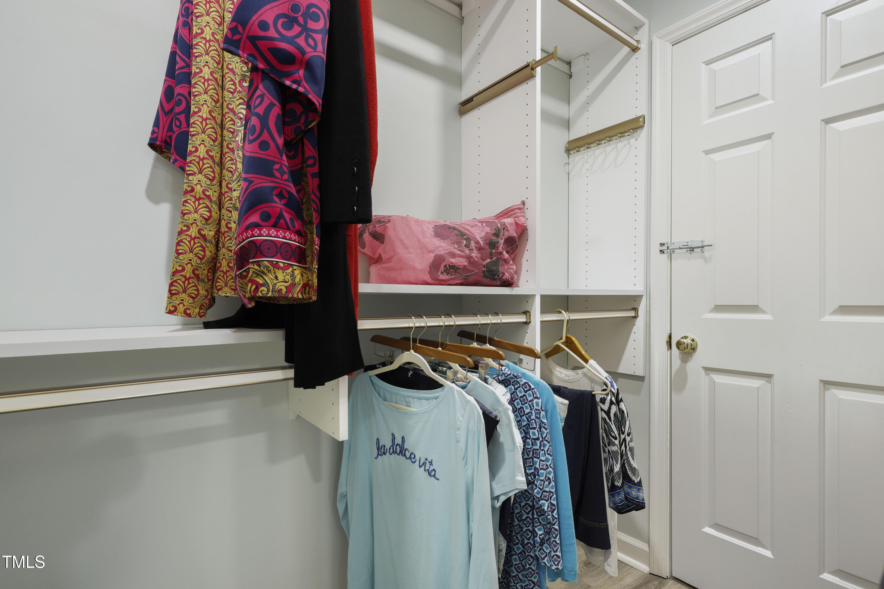 720 Springfork Drive Cary, NC 27513 - Photo 20 of 34 a view of walk in closet with clothes and shoes